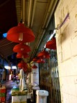 Market traders use these red lights as they cast a warm glow onto fruits, meats and vegetables and enhance their visible appeal. 